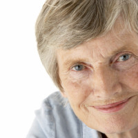 Portrait of senior woman smiling at the camera Portrait of senior woman smiling at the camera